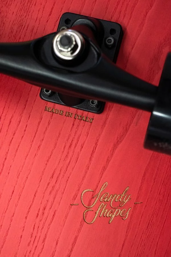Sandy Shapes and "made in Italy" logos engraved on one of our surfskates